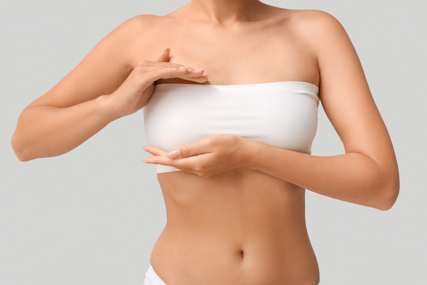 women with a top on that covers her nipples, considering nipple surgery, plastic surgery.